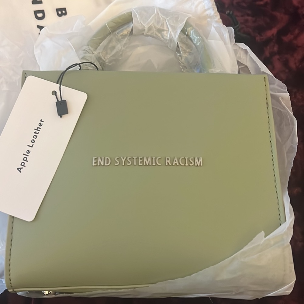 Brandon blackwood end systemic racism leather bag